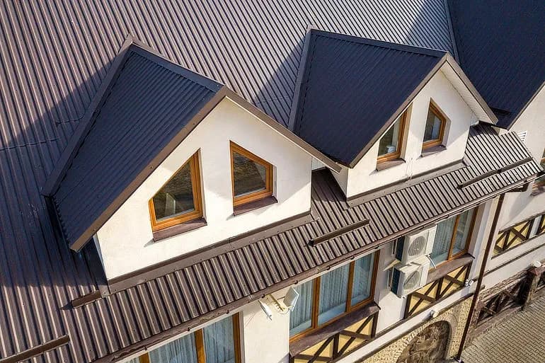 6668e5845b3a5a4bea034ce9_metal-roofing-installed-house.webp